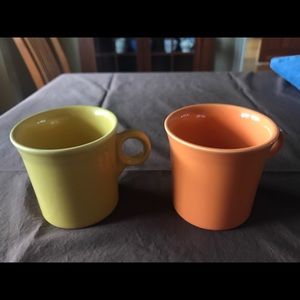 Two Fiesta Ware mugs tangerine and sunflower